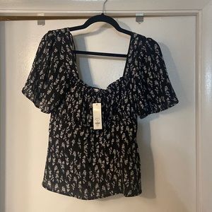 Short sleeve black blouse with floral detailing